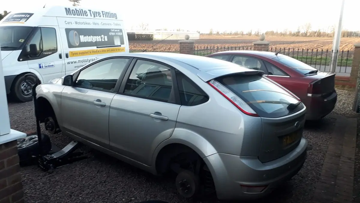 Mototyres 2 u fitting 2 new replacement tyres on Ford Focus at Long Sutton in Lincolnshire.